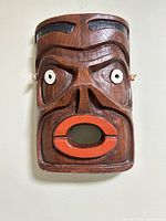 Front view of Tlingit ceramic mask on wall