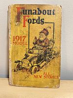 Front cover showing title, illustration, wear on edges and spine