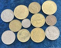 All thirteen coins grouped on blue background