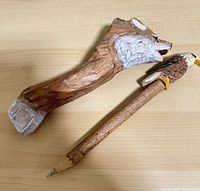 Wolf figure and eagle-top pencil overview