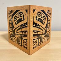 Front and side view of wooden desk organizer showing Northwest Coast art