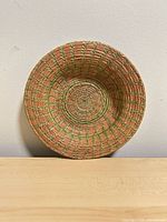 Top view of handmade coiled seagrass basket showing weave pattern