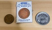 Three tokens laid out: Edmonton, Nevada in case, Trees of Mystery