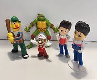 Front view of five small figures