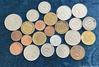 All 23 German Deutsche Mark coins laid out on fabric