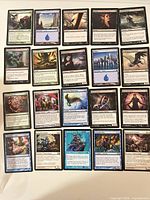 Front view showing 20 sleeved MTG cards laid out in 5×4 grid