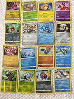Full layout of 16 holographic Pokémon cards