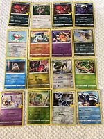All 16 cards laid out on surface