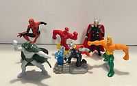 Front view of six superhero figurines