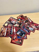 pile of red-border Star Trek trading cards on tabletop