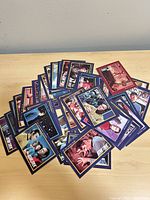 Pile of Star Trek trading cards spread on table