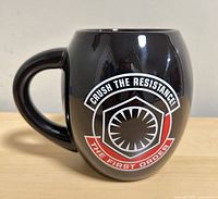 Front view of black ceramic mug showing First Order emblem and slogan