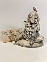 Front view of figurine with tag visible