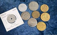 Overview showing all nine tokens including one in holder