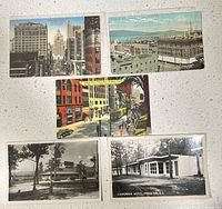 All five postcards front view on countertop