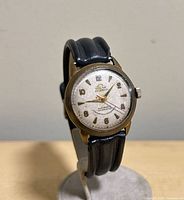 Front angled view of Solar wristwatch showing dial details and strap