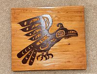 Full view of wooden raven plaque front