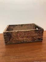 Overall view of wooden Zip Pop crate front with branding