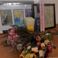 Overall lot view showing frames, candles and floral stems