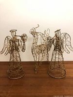 Front view of two wire angels and one wire reindeer