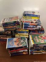 All stacks of VHS tapes on table