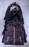 Stack of eleven jackets front view