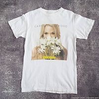 Front view of white Carrie Underwood Play On Tour T-shirt laid flat