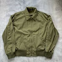 Front view of olive green Club Monaco jacket showing overall design and condition