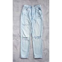Full front view of light wash Denim Forum jeans showing distressing and overall condition