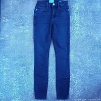 Full front view of Frame Le High Skinny dark indigo jeans