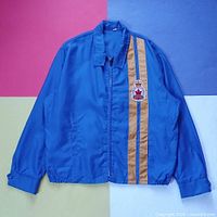 Front view of blue jacket with yellow stripes and Legion crest