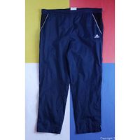 Full view front of navy Adidas track pants