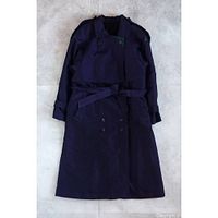 Full view of trench coat laid flat