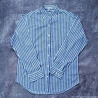 Front view of striped long-sleeve shirt laid flat