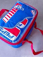 Full view of blue and red Pepsi/KFC cooler bag showing graphics and handles