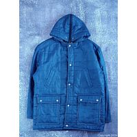 Full front view of blue quilted jacket showing pockets and overall design