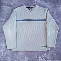 Full front view of the sweater laid flat