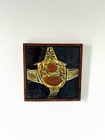 front view of framed ceramic tile artwork showing abstract design and frame