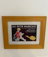 Front view of framed advertisement on wall