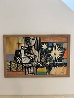 Framed abstract oil painting on wall