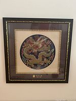 Framed silk brocade gold dragon tapestry close-up