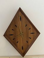 Full view of diamond wall clock on wall