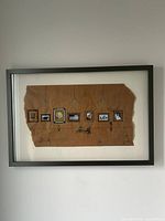 Full view of framed artwork on wall