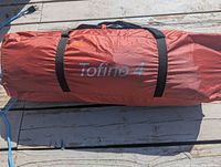 Red carry bag with ‘Tofino 4’ text