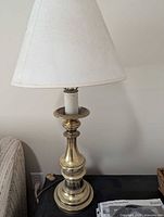 Tall brass candlestick table lamp with shade