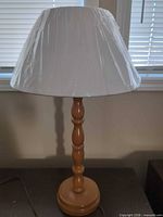 Turned wood lamp with shade