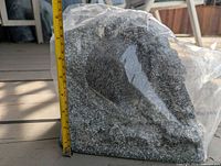 Full view showing rock speaker height against tape measure