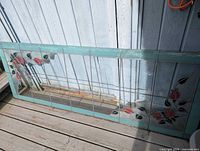 Full view of stained glass panel leaning against wall
