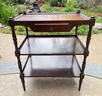 Front view showing three tiers, drawer closed