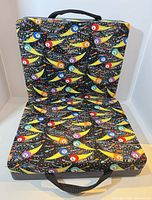Open chair showing bingo pattern and seat/back cushions